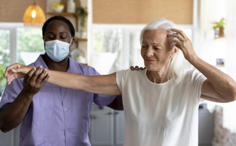 male-social-worker-taking-care-old-woman